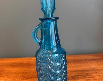 Aceitera vintage de margaritas y botones color turquesa.