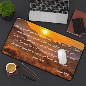 May include: A sunset-themed mousepad with a Bible verse from Malachi 3:10. The verse reads: "Bring ye all the tithes into the storehouse, that there may be meat in mine house, and prove me now herewith, saith the Lord of hosts, if I will not open you the windows of heaven, and pour you out a blessing, that there shall not be room enough to receive it."
