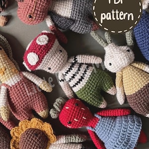 May include: A collection of various crocheted dolls featuring diverse designs, including a mushroom-capped figure, a sunflower-headed doll, and a red-headed character in a blue dress. A circular brown label with the text PDF pattern is visible.