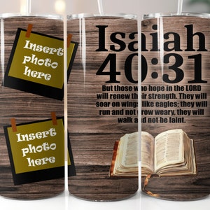 May include: A brown wooden tumbler with a photo insert area and the text "Insert photo here". The tumbler also features a Bible verse from Isaiah 40:31, "But those who hope in the LORD will renew their strength. They will soar on wings like eagles; they will run and not grow weary, they will walk and not be faint."