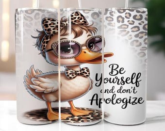 May include: A stainless steel tumbler featuring a cartoon duck wearing sunglasses, a bow, and a bow tie, all with a leopard print design. The tumbler has the text "Be Yourself and don't Apologize".
