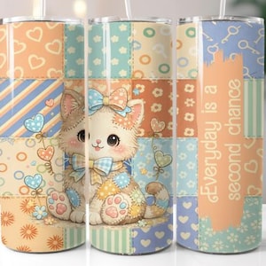 May include: A set of three stainless steel tumblers with lids and straws. Each tumbler features a patchwork design with a cartoon kitten, hearts, and the text "Everyday is a second chance". The tumblers are decorated in pastel colors.