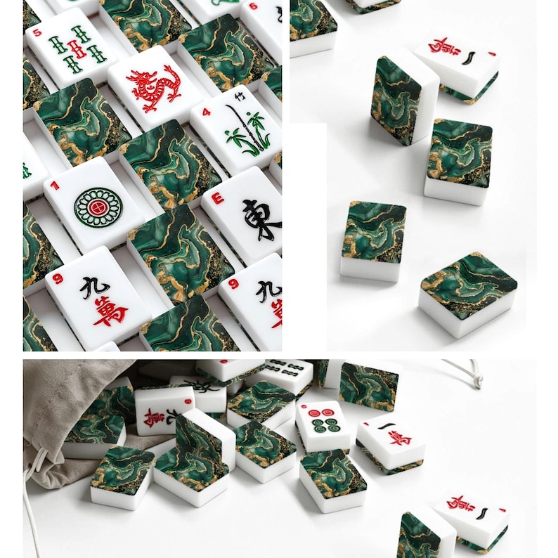 May include: A set of mahjong tiles featuring a white base and a green and gold marbled pattern on the back. The tiles display various traditional Chinese characters, bamboo symbols, and circular designs in red, green, and black ink colors.