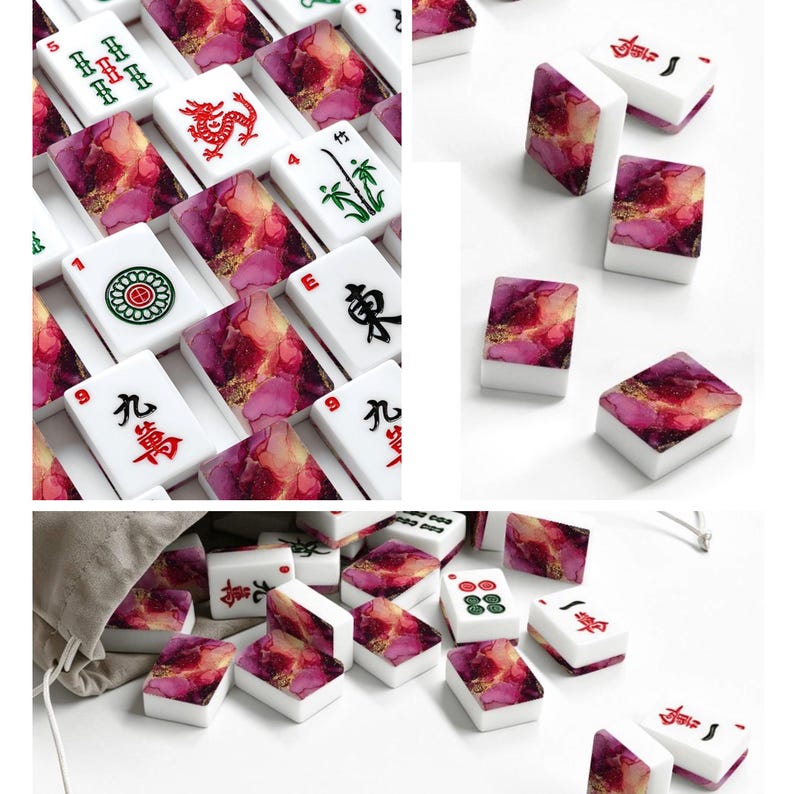 May include: A set of rectangular mahjong tiles featuring white faces with black, red, and green traditional symbols and characters, paired with backs displaying a vibrant, swirling abstract pattern of magenta, pink, and gold alcohol ink.