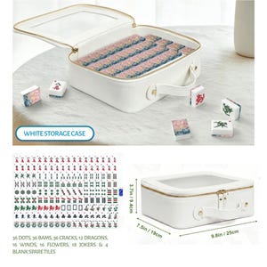 May include: A white rectangular storage case with a clear top window and handle, containing mahjong tiles with floral patterns. The set includes 36 dots, 36 bams, 36 cracks, 12 dragons, 16 winds, 16 flowers, 18 jokers, and 4 blank tiles, measuring 9.8in by 7.5in by 3.7in.