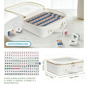 May include: A white rectangular storage case with a clear top window and gold zipper, containing blue and orange patterned mahjong tiles. Additional tiles are scattered nearby. The case measures 9.8 inches by 7.5 inches by 3.7 inches.