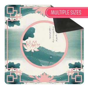 May include: A square mat featuring a cream-coloured background with a central pink circle containing a pink lotus flower and dark green leaves. The border has a pink geometric frame. Text within the circle reads, a symbol of beauty that comes out of a difficult situation.