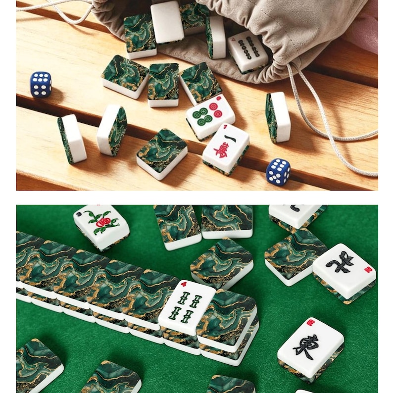 May include: A mahjong set featuring rectangular tiles with a green and gold marbled pattern on the back and white faces with various black, red, and green symbols. The set includes two blue six-sided dice and a beige drawstring storage bag.