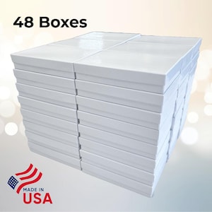 May include: A pile of 48 white rectangular boxes, stacked together. The boxes have a simple, clean design. The image includes the text "48 Boxes" and a "Made in USA" graphic.