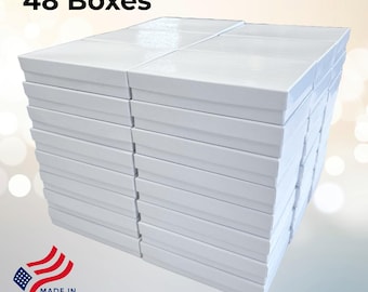 May include: A pile of 48 white rectangular boxes, stacked together. The boxes have a simple, clean design. The image includes the text "48 Boxes" and a "Made in USA" graphic.