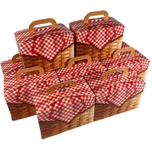 May include: A stack of eight red and white gingham picnic basket-themed gift boxes with brown handles. The boxes are made of cardboard and have a realistic picnic basket design.