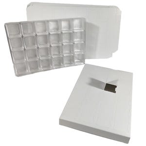 May include: Clear plastic tray with 24 compartments, alongside a stack of white cardboard sheets and a white cardboard box with a cutout. The tray is designed to hold small items, and the box and sheets appear to be packaging.