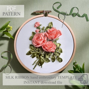 May include: A PDF pattern for a silk ribbon embroidery project featuring a bouquet of pink roses with green leaves. The pattern is displayed in a wooden embroidery hoop.