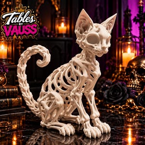 May include: A cream-colored, open-work cat figurine constructed from interconnected bone-like structures. The sculpture features a curled tail and hollow eye sockets. The text 'Tables BY VAUSS' with a crown icon is visible in the upper left.