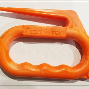 May include: Bright orange FishLifter tool. The tool has a handle with finger grips and a pointed extension. The text "FishLifter" is printed on the handle. The tool is made of a solid, durable material.