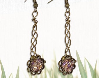 Hand-crafted antique bronze braided wire sparkly flower dangle earrings.