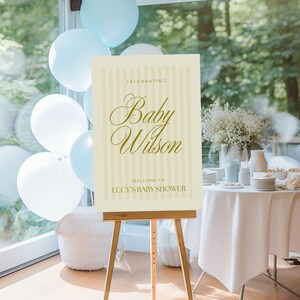 Digital yellow baby shower sign for Canva, presented in a styled event scene with white and yellow decorations — customizable welcome poster perfect for spring baby showers.