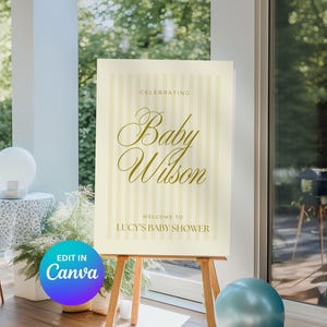 Editable baby shower sign in yellow stripes, shown on a wooden easel surrounded by party decor — ideal for boy, girl, or gender-neutral showers.