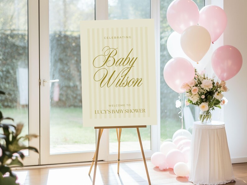 A0 yellow striped baby shower welcome poster shown at a cheerful spring-themed celebration — digital download template editable in Canva for instant customization.
