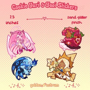 May include: A set of four character stickers titled Cookie Yuri & Yaoi Stickers, measuring 2.5 inches with a sand glitter finish. The designs feature stylised figures in pink, red, blue, and gold tones, including a winged character and a staff-wielder.