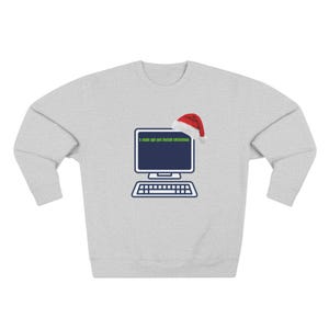 May include: A light grey sweatshirt with a computer graphic and a Santa hat. The computer screen shows the text "sudo apt-get install christmas". The design is in white and navy blue.