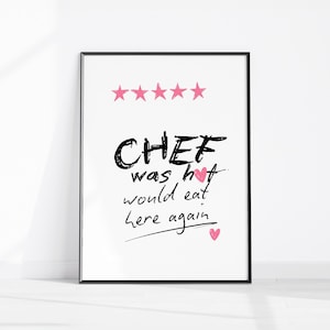 May include: A framed print with the words "CHEF was hot would eat here again" in black script. Pink hearts and five pink stars accent the text. The print is in a black frame.