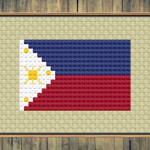 Könnte beinhalten: Ein gerahmtes Kreuzstichbild der philippinischen Flagge. Die Flagge ist rot, weiß und blau mit einer gelben Sonne und acht Sternen in der oberen linken Ecke.