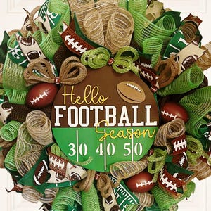 May include: A decorative football-themed wreath with green, brown, and tan mesh ribbons. The wreath features miniature footballs and a central sign that reads "Hello FOOTBALL Season" with yard line markings.