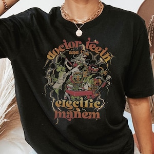 May include: Black oversized t-shirt with a graphic print of a band called "Doctor Teeth and the Electric Mayhem". The band is made up of Muppet characters playing musical instruments.