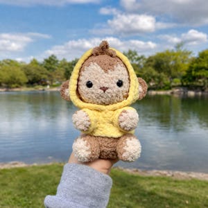 May include: A set of three ceramic mugs with a speckled, matte finish. The mugs are in shades of cream, light gray, and dark gray. Each mug has a simple, minimalist design, perfect for coffee or tea.