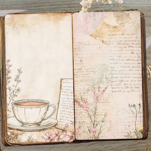 May include: Open vintage journal with aged paper pages. A teacup and saucer are on the left page, with floral and script details. The right page has script and floral elements. Dried flowers and a key are on the wooden surface.