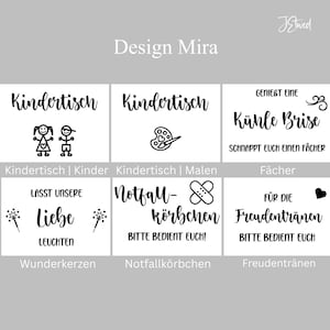 May include: A set of six white rectangular signs with black text and graphics. The signs feature German phrases including Kindertisch, Genie&szlig;t eine k&uuml;hle Brise, Lasst unsere Liebe leuchten, Notfall-k&ouml;rbchen, and F&uuml;r die Freudentr&auml;nen with icons.