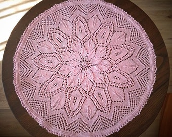 Knitted light pink doily