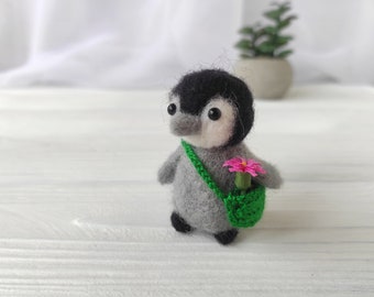 Miniature penguin felted from wool
