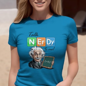 May include: A turquoise t-shirt with the phrase "Talk Nerdy to me!" and a cartoon image of Albert Einstein holding a chalkboard with the equation E=mc². The word "NERDY" is spelled out using elements from the periodic table.
