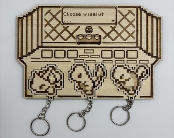 Professor Oak laboratory wall support key holder with Pokémon keychains: Initial Trio of Charmander, Bulbasaur and Squirtle in Wood