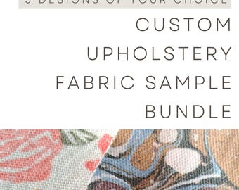 May include: A custom upholstery fabric sample bundle featuring 3 designs of your choice. The image displays two fabric swatches: one with a floral pattern in pink and orange, and another with a marbled pattern in brown, blue, and white tones.