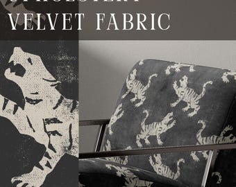 May include: An armchair upholstered in dark gray velvet fabric featuring a repeating off-white tiger pattern. The chair has a thin, dark metal frame. Text on the image reads UPHOLSTERY VELVET FABRIC and APOSTROFO DESIGN.