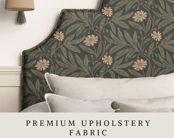 May include: A scalloped headboard upholstered in a dark charcoal fabric featuring a repeating pattern of muted green leaves and light beige flowers. The text "PREMIUM UPHOLSTERY FABRIC" and "APOSTROFO DESIGN" is printed at the bottom of the image.