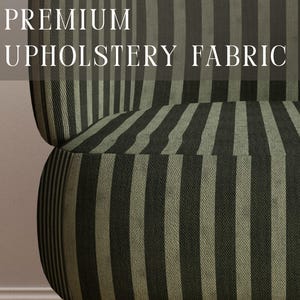 May include: A chair upholstered in a fabric featuring vertical stripes in alternating shades of dark olive green and muted sage green. The text PREMIUM UPHOLSTERY FABRIC is displayed at the top, and APOSTROFO DESIGN is printed at the bottom.