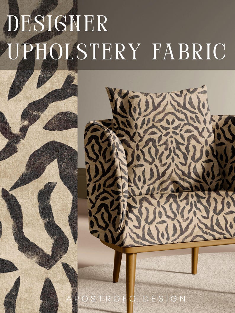 May include: An armchair upholstered in a beige fabric with a dark brown abstract animal-like print. The chair features a square back cushion and a seat cushion with the same pattern. The text DESIGNER UPHOLSTERY FABRIC and APOSTROFO DESIGN appear.