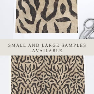 May include: Two rectangular paper samples featuring a dark brown abstract animal print pattern on a light beige background. The text APOSTROFO DESIGN appears at the top, and the text SMALL AND LARGE SAMPLES AVAILABLE is centred between the two prints.