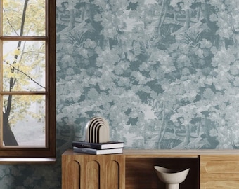 May include: A teal and white wallpaper featuring a dense forest landscape pattern with trees and foliage. The wallpaper is displayed on a wall behind a wooden cabinet with a curved arch design, a small wooden rainbow sculpture, and books.