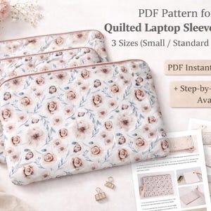 May include: Three quilted laptop sleeves with a floral pattern in shades of white, pink, and blue. The sleeves are displayed with a PDF pattern, which includes the text "PDF Pattern for Quilted Laptop Sleeve Bundle" and "3 Sizes (Small / Standard / Large)".