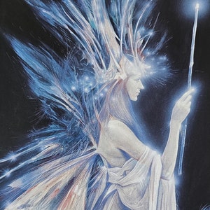 May include: A blue and white faery with wings and a glowing wand stands in front of a dark background. The faery is holding the wand in her right hand. The faery is wearing a white dress and has long, flowing hair. The faery is surrounded by a blue aura. The text "The Faery of Transformation" is at the top of the image. The text "The touch of this faery's wand brings clarity and a certain transparency. Like this faery, we become transparent to ourselves, able to see that every inner space and corner is clear, bright, free from hidden agendas or distorted motivations. Above the temple of the Delphic Oracle and on the portal to Faeryland are carved two words of magic and power: "Know thyself."