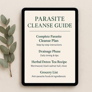 May include: A digital tablet shows a "Parasite Cleanse Guide" with information on a complete cleanse plan, drainage phase, herbal detox tea recipe, and grocery list. The tablet is on a neutral background with a sprig of green leaves.