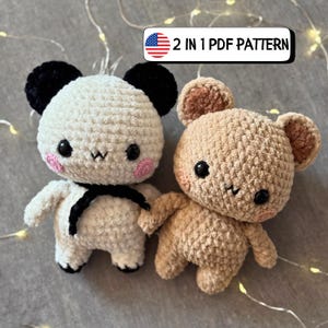May include: Two crocheted plush toys: a panda and a bear. The panda is white with black ears and a black scarf. The bear is tan with brown ears. Both have black eyes and pink cheeks. The text "2 IN 1 PDF PATTERN" is in a banner.