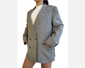 May include: A grey double-breasted blazer with a checked pattern.