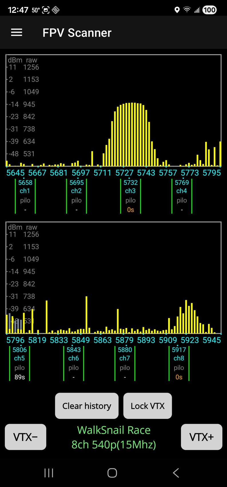 May include: Screenshot of a mobile device showing the "FPV Scanner" app. The display features yellow bar graphs and numerical data, indicating real-time information. Text includes app name and other details.