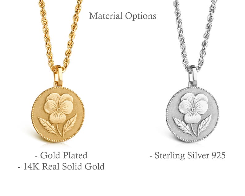 May include: Two necklaces with rope chains and circular pendants featuring a pansy flower design. One pendant is gold-colored with text reading Material Options, Gold Plated, and 14K Real Solid Gold. The other is silver-colored with text reading Sterling Silver 925.